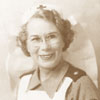Click for larger image. Red Cross Escort Officer May Feetham.